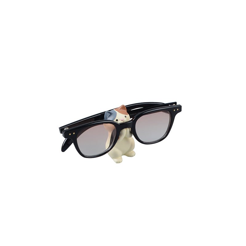 Cute Cat Figurine Sunglasses Holder holding a glasses 