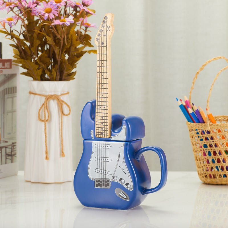 Blue electric guitar mug with lid and decorative items