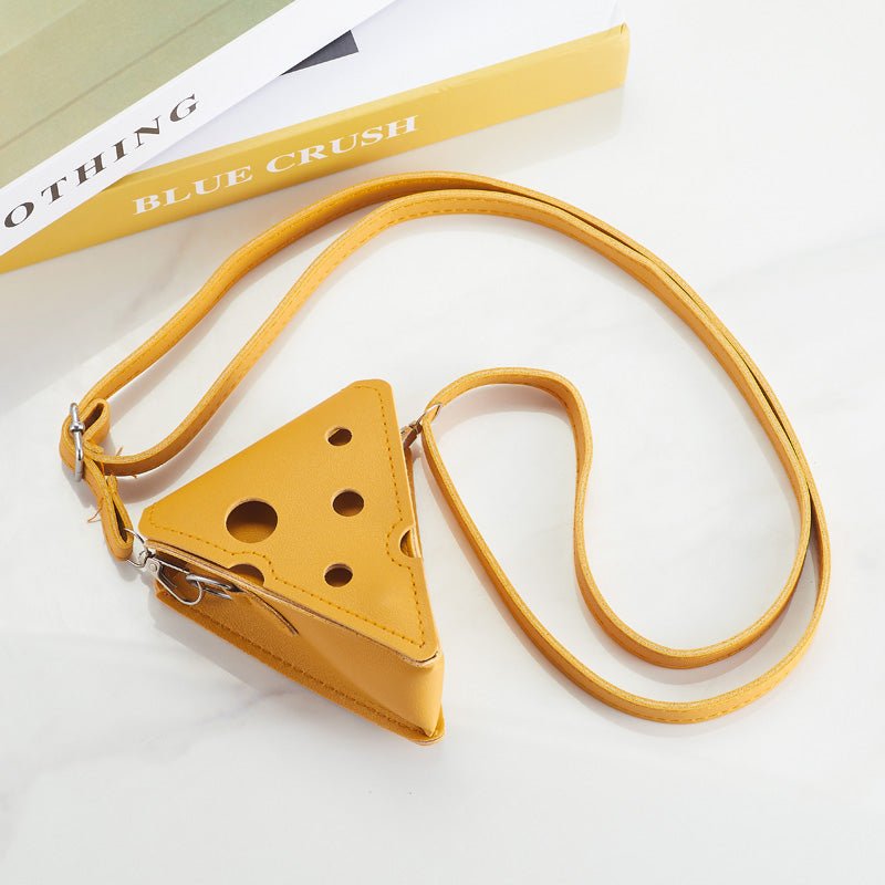 Side view of cheese-shaped crossbody bag showing buckle