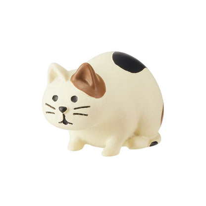 Cute crouching cat figurine, front view