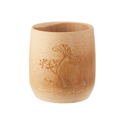 Handcrafted bamboo cup with an engraved lotus design