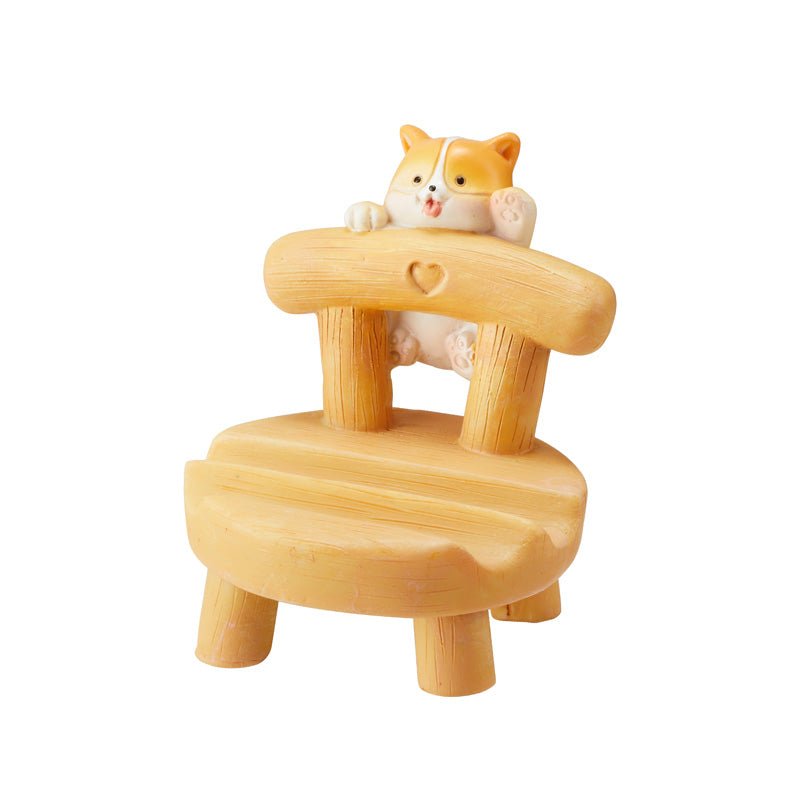 Cute cat on a wooden chair phone holder