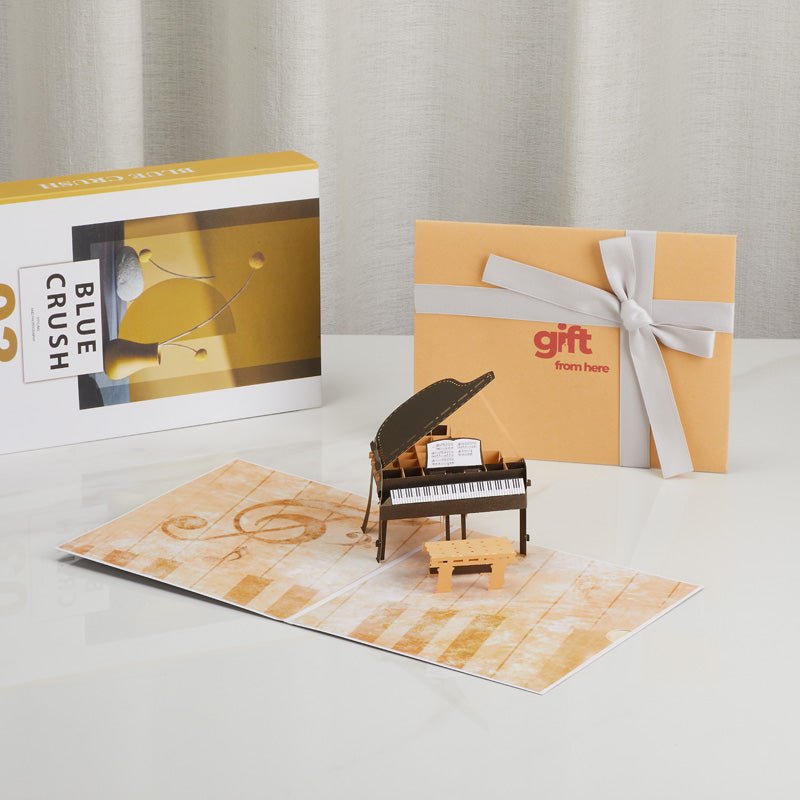 3D Pop-Up Piano Greeting Card displayed with gift packaging