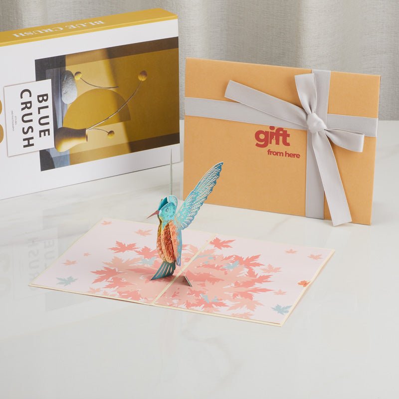 3D Pop-Up Greeting Card with a hummingbird design displayed with gift packaging