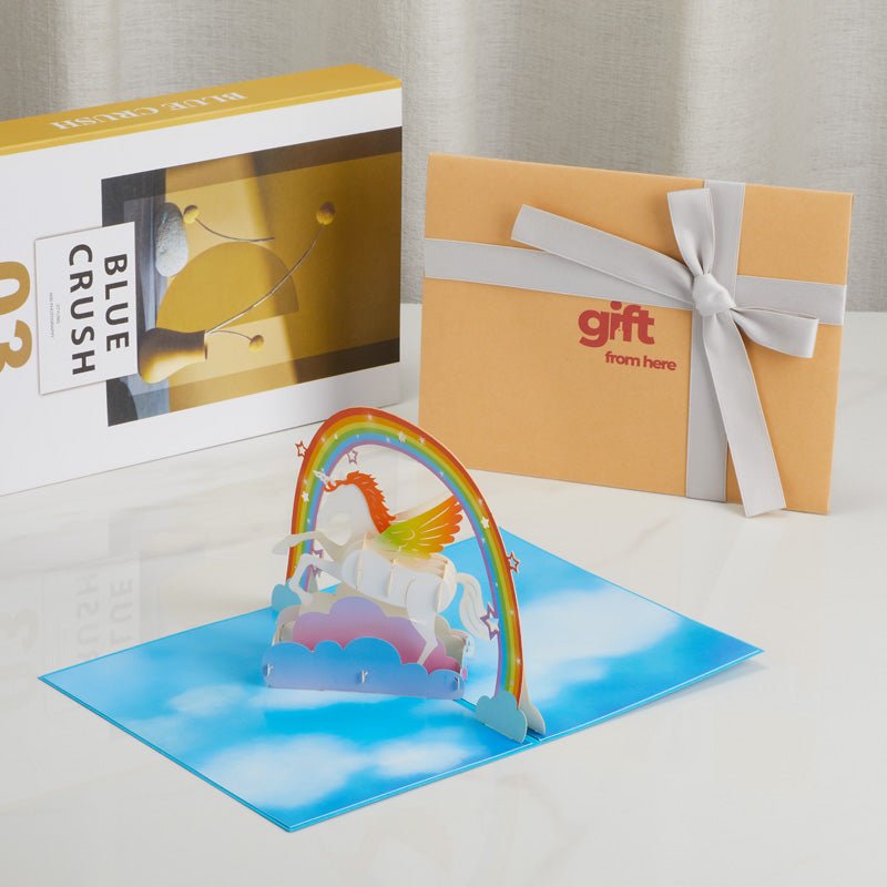 3D Pop-Up Unicorn Greeting Card displayed with gift packaging