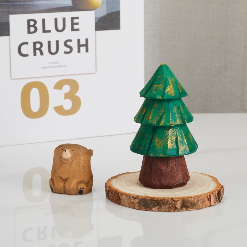 Wooden tree and bear figurine set displayed on table
