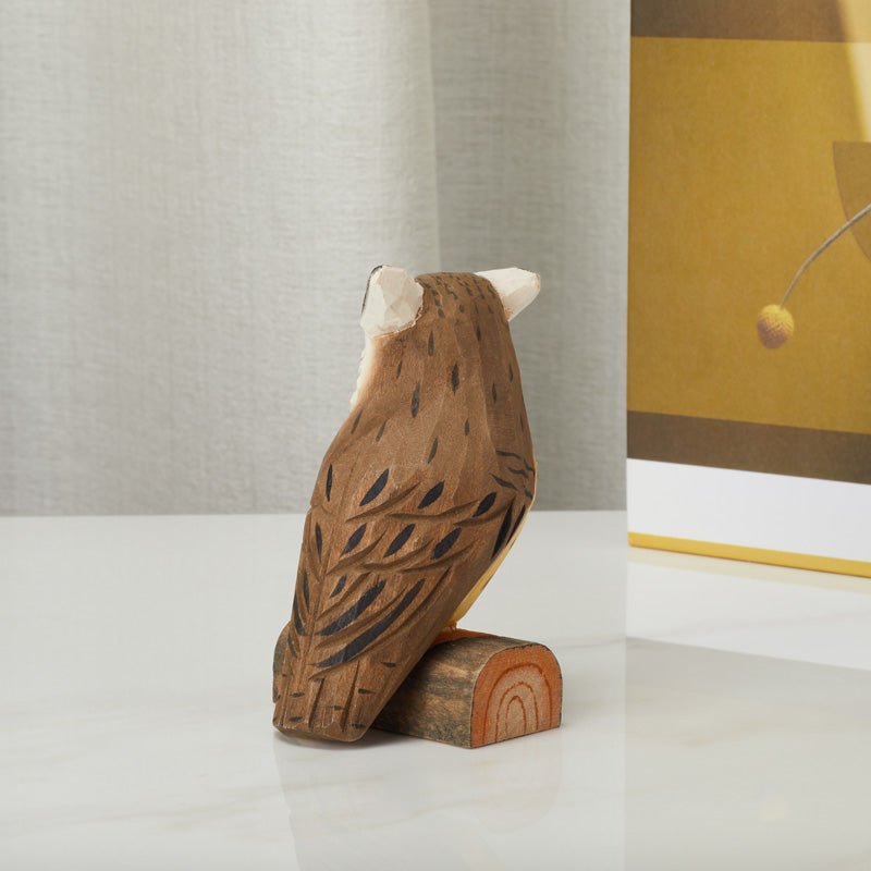 Hand-carved wooden owl figurine, back view