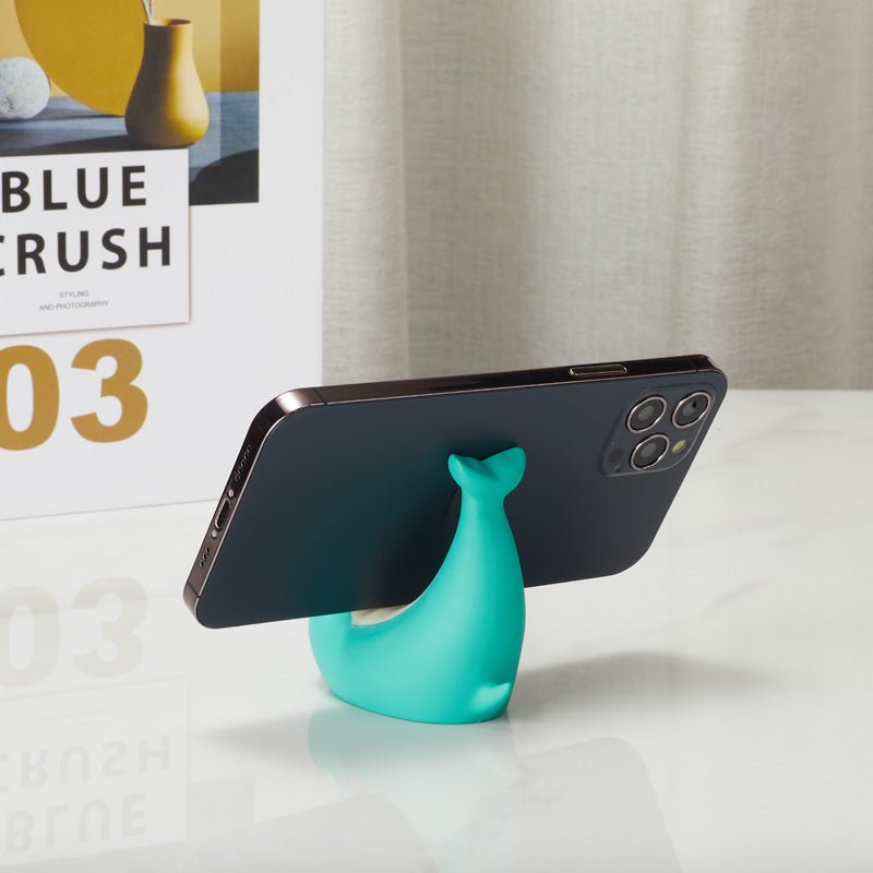 Back view of dolphin-shaped phone holder with a smartphone