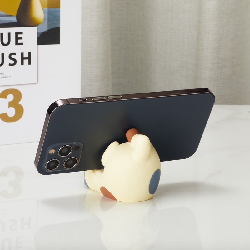 Upside down cat phone holder supporting a smartphone from the back