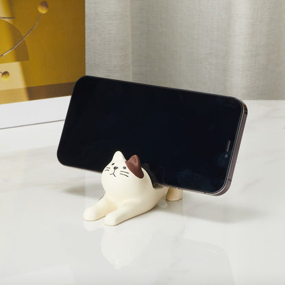 Cat phone holder supporting a smartphone from the side