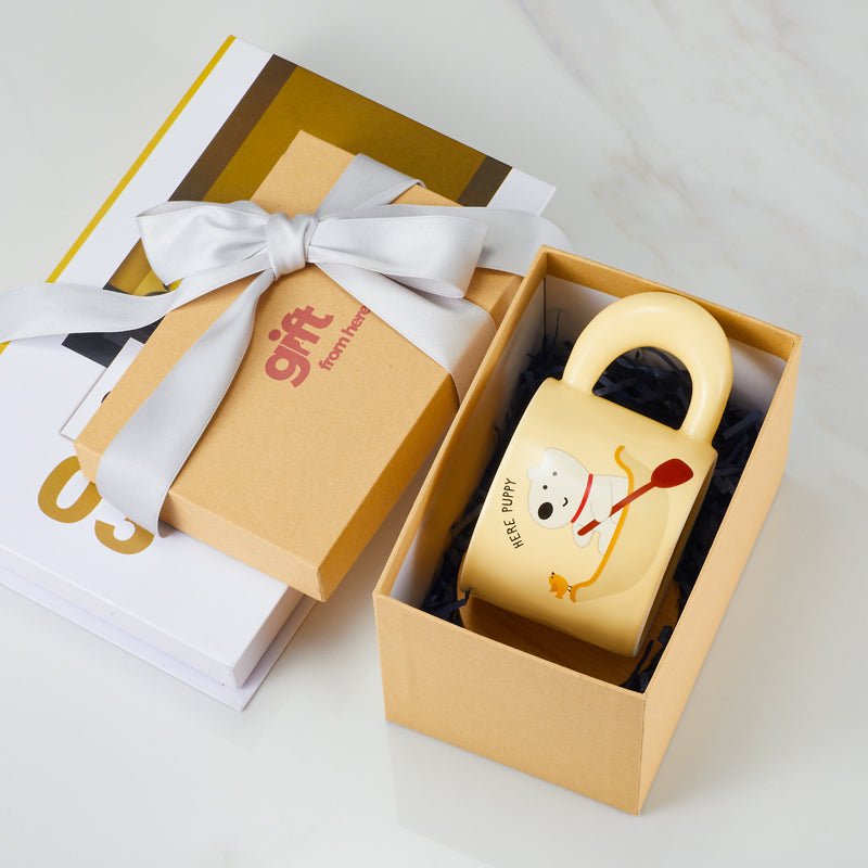 Cute puppy and bird cartoon mug in a gift box with a ribbon