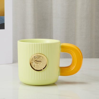 Side View of Elegant Ceramic Mug with Gold Deer Emblem