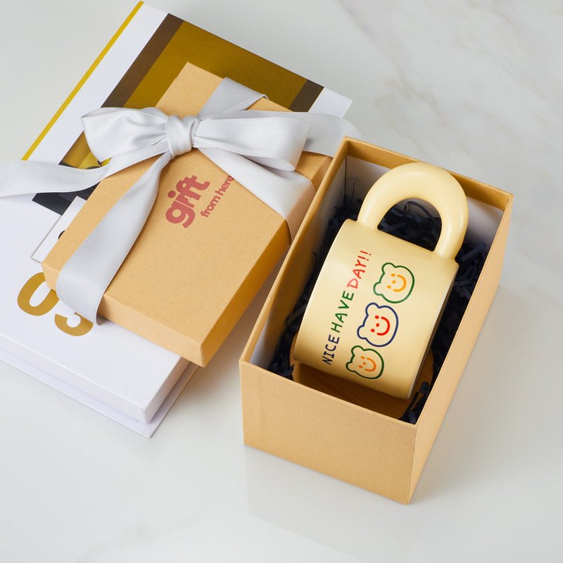 Cute bear faces mug in a gift box with a ribbon