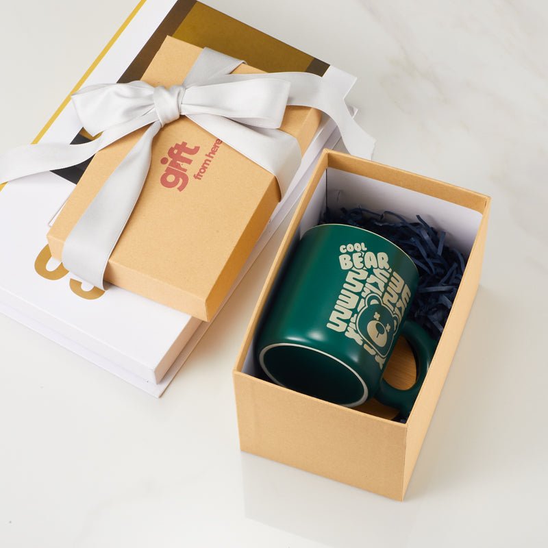 Green cool bear mug in a gift box with a ribbon