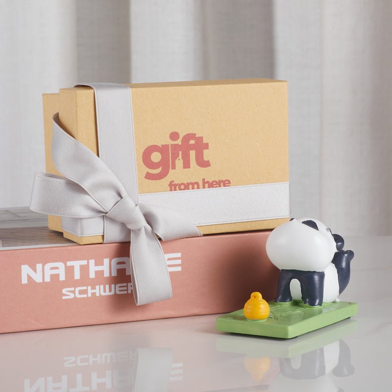 Gift box with a small panda figurine phone holder