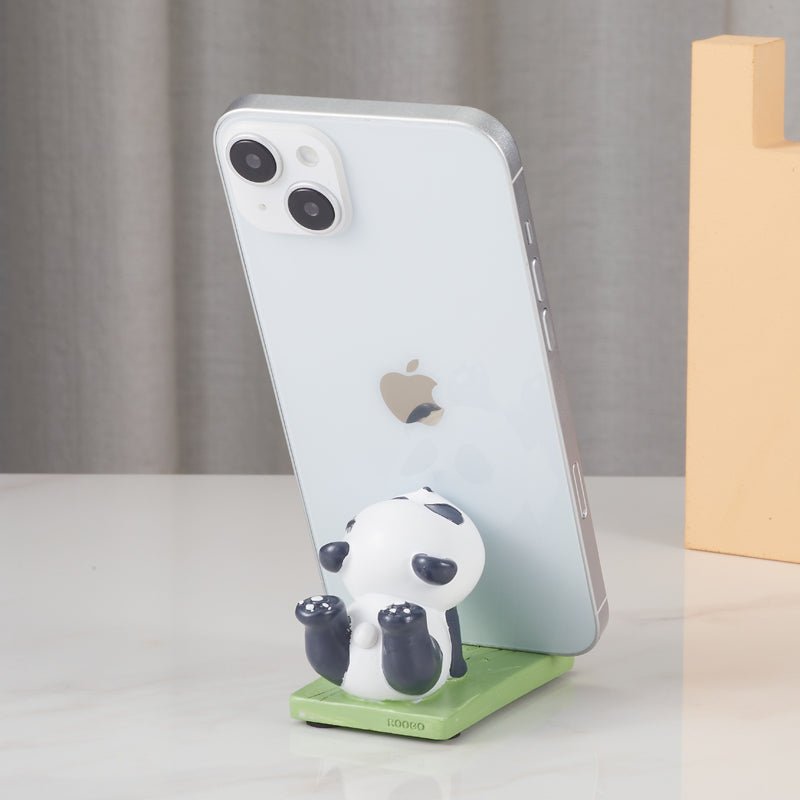 Back view of panda figurine phone holder with a phone
