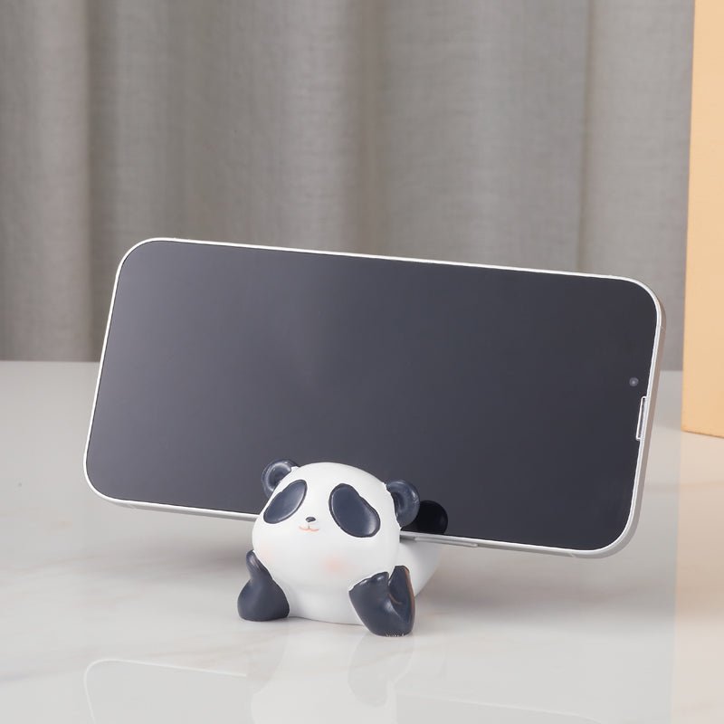 The panda phone holder supporting a smartphone in landscape orientation