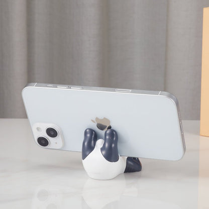 The back view of the panda phone holder with a smartphone in place