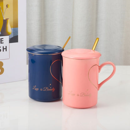 Blue and pink Love is Beauty ceramic mugs with lids and gold spoons