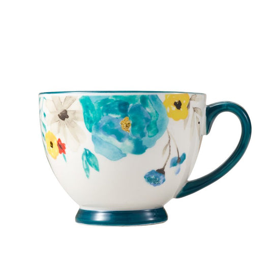 Floral-patterned ceramic mug with blue handle