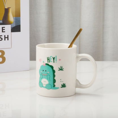 White ceramic mug with cute dinosaur illustration on a table